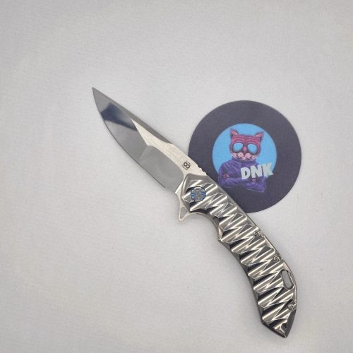 Olamic Cutlery Wayfarer 247 CTS-XHP Mike Irie Drop Point High Polish Scalloped Ti Blue Ano Hardware
