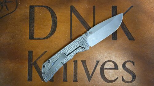 McNees Knives PM Mac 2 Jigged Stonewashed Titanium 3.5″ Atomic Magnacut Drop Point