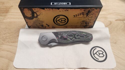 KB Knives KB266A Velvet Snake Frame Lock Knife, Stonewashed M390 Blade & Watermelon Sugar Camo Carbon Fiber Inlay Titanium Handle Preowned