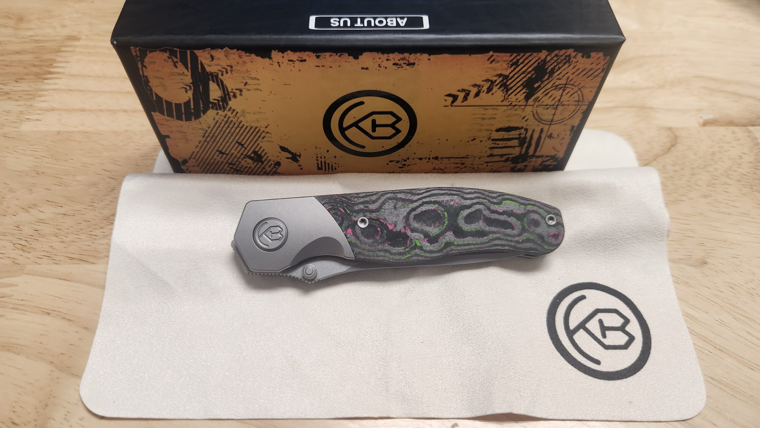 KB Knives KB266A Velvet Snake Frame Lock Knife, Stonewashed M390 Blade & Watermelon Sugar Camo Carbon Fiber Inlay Titanium Handle Preowned KB Knives KB266A Velvet Snake Frame Lock Knife, Stonewashed M390 Blade & Watermelon Sugar Camo Carbon Fiber Inlay Titanium Handle Preowned - Image 2