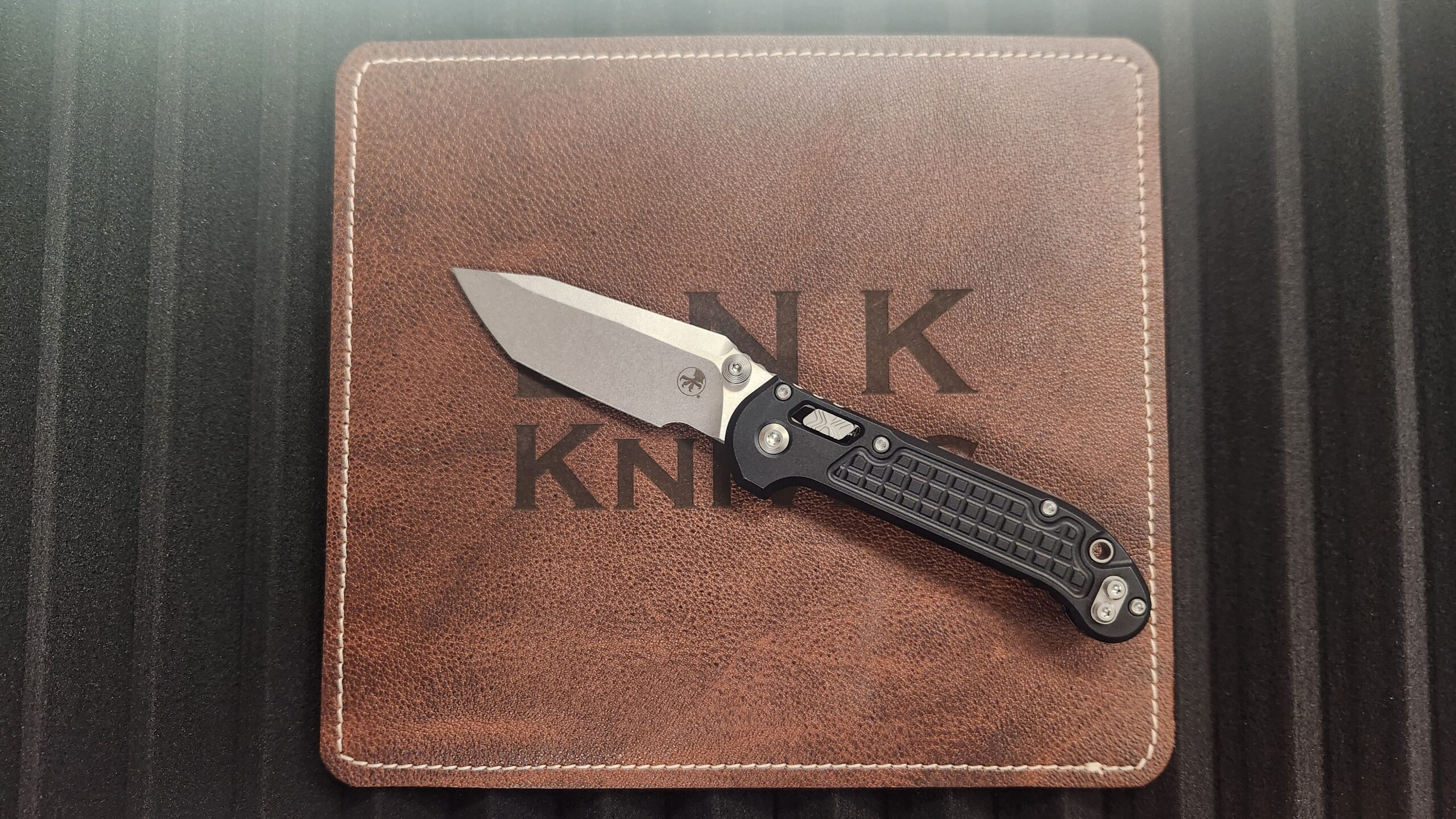 Microtech 1136RL-10FR L.U.D.T. RAM-LOK Manual Folding Knife, Stonewashed M390MK Tanto Blade & Black FRAG Aluminum Handle Microtech 1136RL-10FR L.U.D.T. RAM-LOK Manual Folding Knife, Stonewashed M390MK Tanto Blade & Black FRAG Aluminum Handle