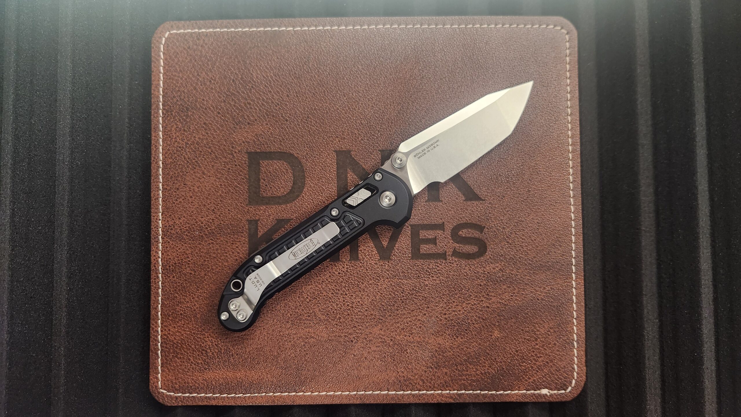 Microtech 1136RL-10FR L.U.D.T. RAM-LOK Manual Folding Knife, Stonewashed M390MK Tanto Blade & Black FRAG Aluminum Handle Microtech 1136RL-10FR L.U.D.T. RAM-LOK Manual Folding Knife, Stonewashed M390MK Tanto Blade & Black FRAG Aluminum Handle - Image 2