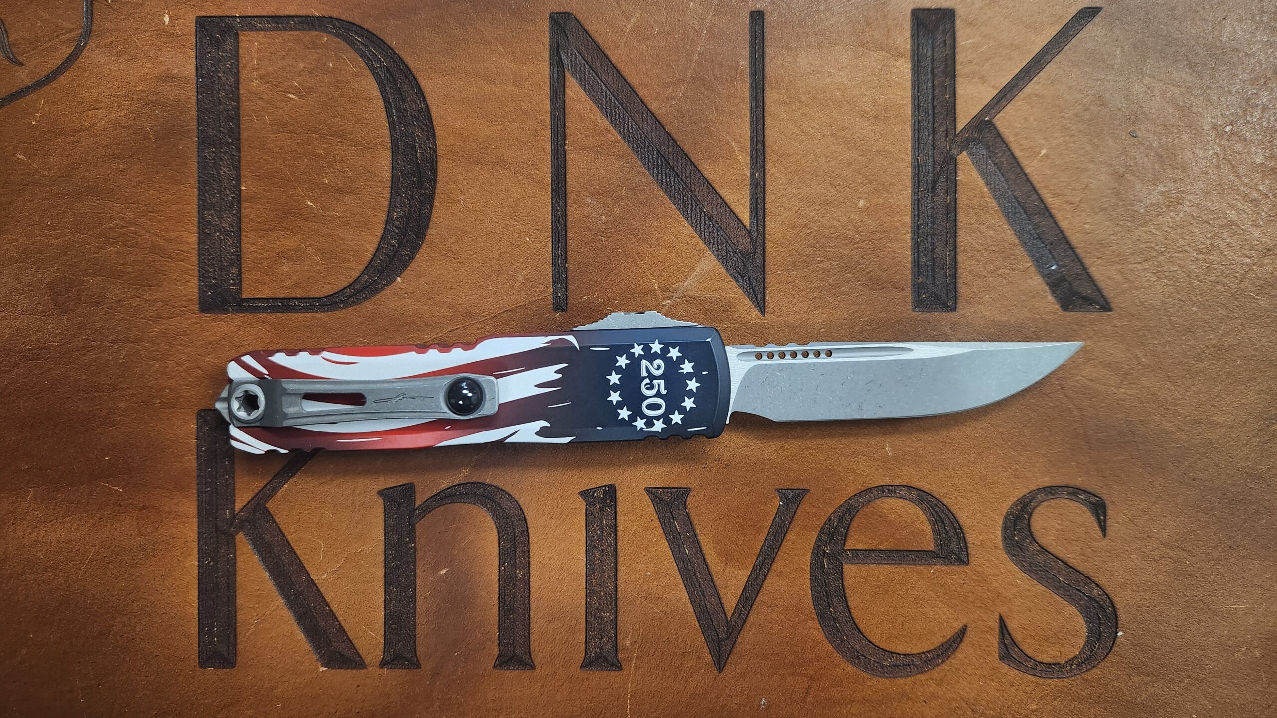 Microtech 12314-10APS-4J250 UTX-85 Gen IV 250th Anniversary OTF Automatic Knife, Apocalyptic M390MK Single Edge Blade & 250th U.S. Flag Graphic Handle Microtech 12314-10APS-4J250 UTX-85 Gen IV 250th Anniversary OTF Automatic Knife, Apocalyptic M390MK Single Edge Blade & 250th U.S. Flag Graphic Handle - Image 2