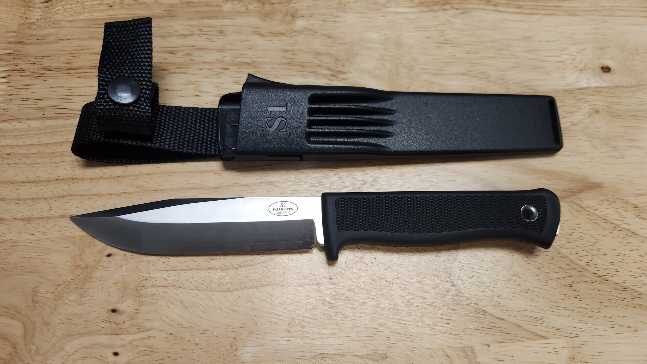 PREOWNED Fallkniven S1 Forest Fixed Blade Knife, Satin Laminated VG10 Clip Point Blade & Black Thermorun Handle PREOWNED Fallkniven S1 Forest Fixed Blade Knife, Satin Laminated VG10 Clip Point Blade & Black Thermorun Handle