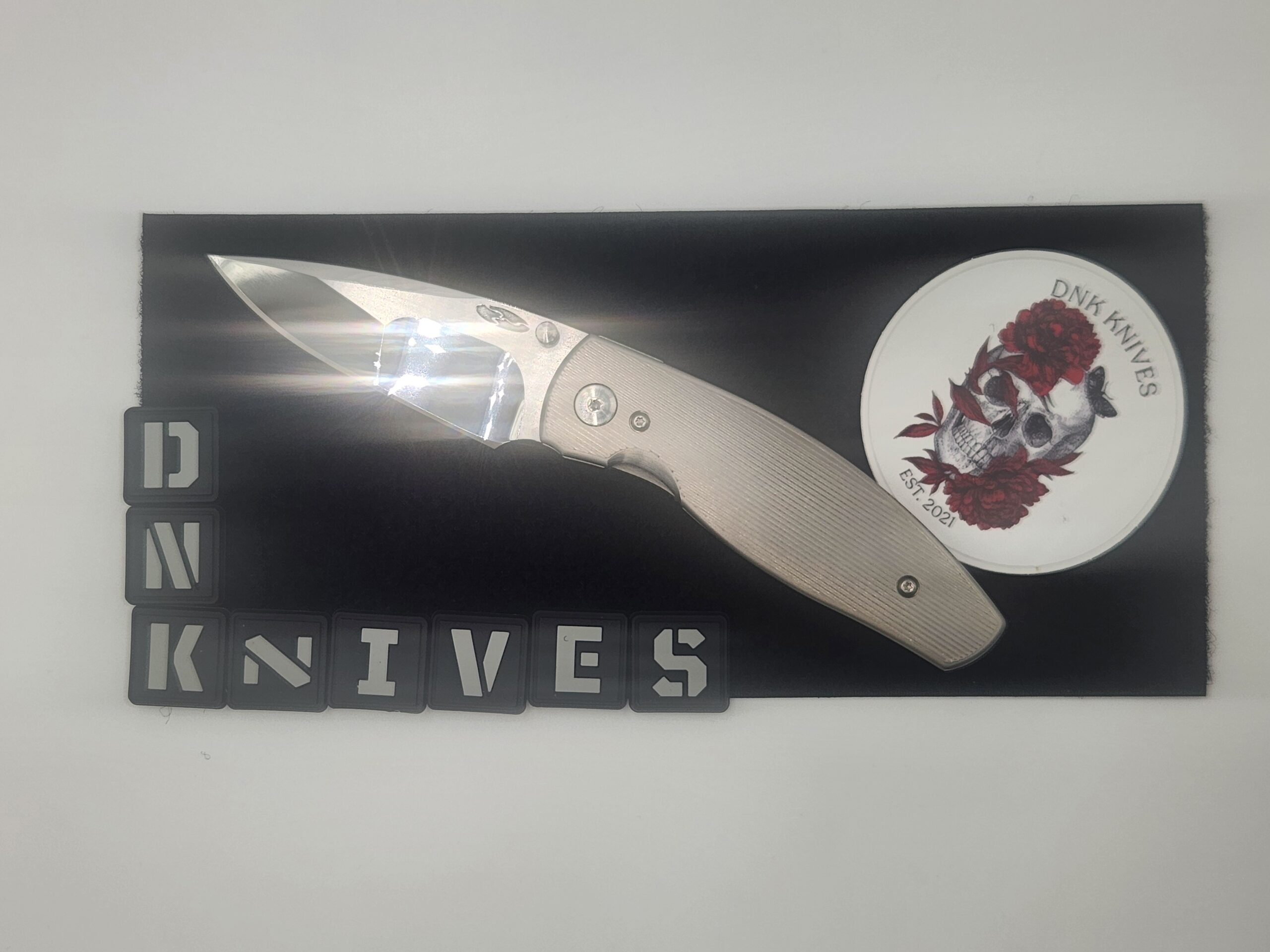 Three Rivers Manufacturing (TRM) Neutron 2 Titanium Folding Knife – Mike Irie Compound Ground Mirror-Polished CPM 154 Blade, Pinstripe Titanium Handle Three Rivers Manufacturing (TRM) Neutron 2 Titanium Folding Knife – Mike Irie Compound Ground Mirror-Polished CPM 154 Blade, Pinstripe Titanium Handle