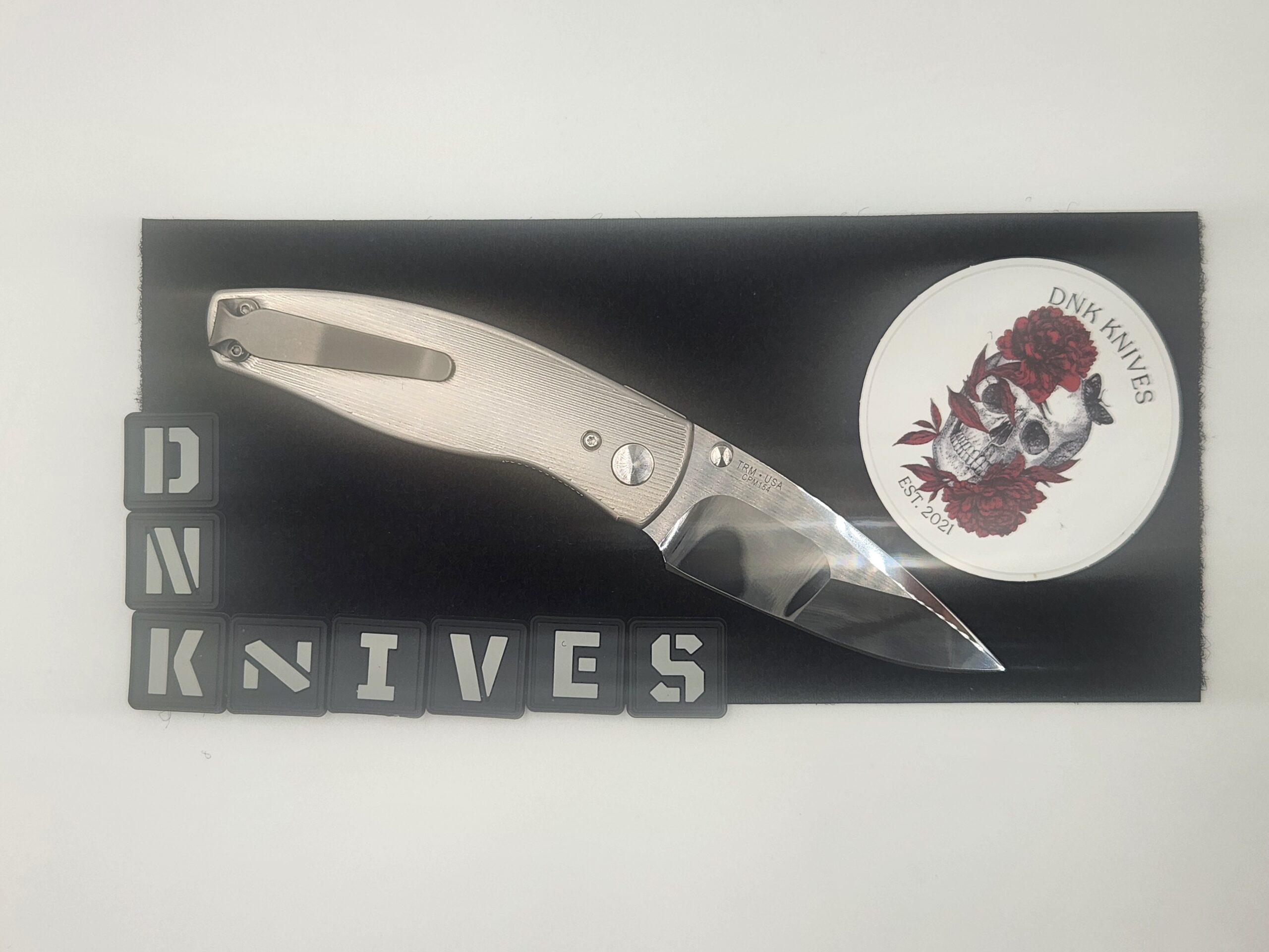 Three Rivers Manufacturing (TRM) Neutron 2 Titanium Folding Knife – Mike Irie Compound Ground Mirror-Polished CPM 154 Blade, Pinstripe Titanium Handle Three Rivers Manufacturing (TRM) Neutron 2 Titanium Folding Knife – Mike Irie Compound Ground Mirror-Polished CPM 154 Blade, Pinstripe Titanium Handle - Image 2